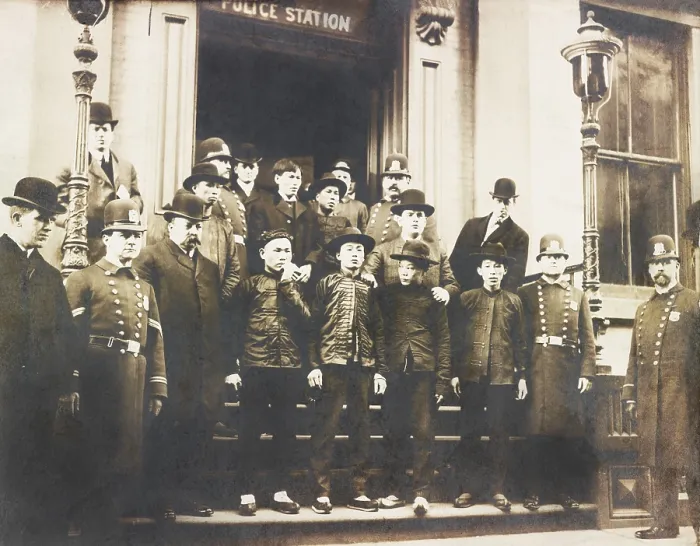 Framed Print : Chinese-American men standing outside NYC Police station with officers, Jan. 24, 1906