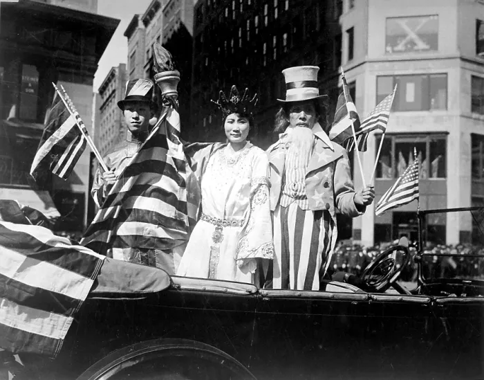 Framed Print : Chinese Americans in the Fourth Liberty Loan Campaign parade. They are costumed as China, Lady Liberty, and Uncle Sam during World War I. New York City. Oct. 1, 1918