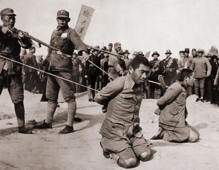 Framed Print : Two Chinese men kneeling prior to execution by Chinese soldiers