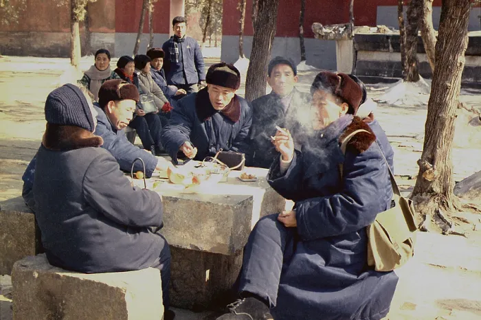 Framed Print : Chinese people in coats and warm hats have lunch outdoors in Beijing during Nixon's visit to China. Feb. 21-27 1972