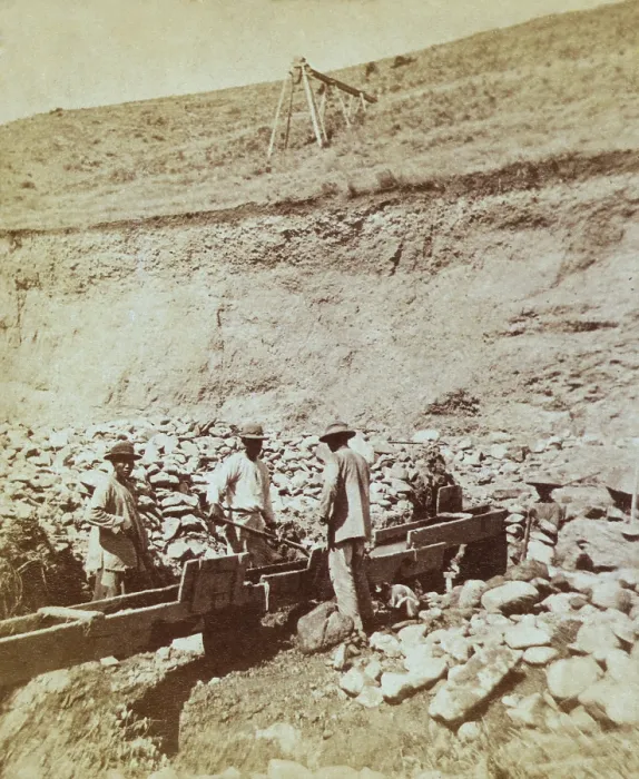 Framed Print : Chinese prospectors washing gold in a sluice box placed in the stream to channel water flown Framed Print : Chinese prospectors washing gold in a sluice box placed in the stream to channel water flown