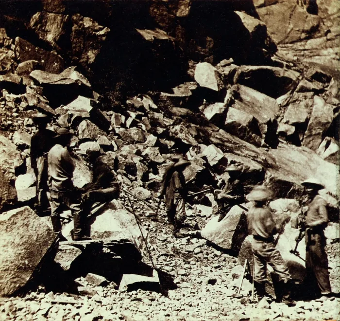Framed Print : Chinese workers wearing traditional clothing while excavating the track bed of the Central Pacific Railroad, in the Sierra Nevada Mountains of California. Ca. 1867
