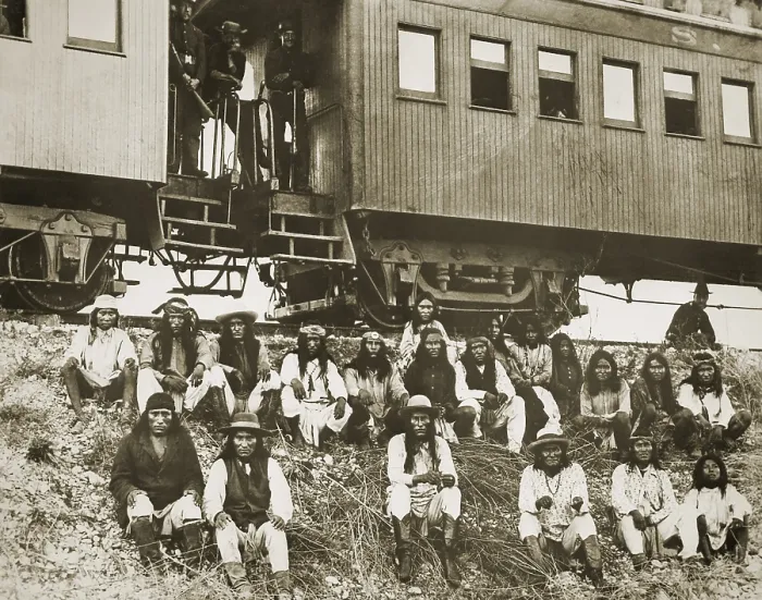 Framed Print : Chiricahua Apache prisoners, including Geronimo (1st row, 3rd from right), sit on an embankment outside a railroad car in Arizona Framed Print : Chiricahua Apache prisoners, including Geronimo (1st row, 3rd from right), sit on an embankment outside a railroad car in Arizona