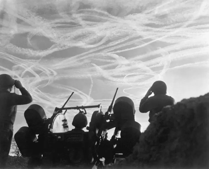 Framed Print : Christmas Day dogfights streaked the sky with vapor trails from Allied and German planes. Soldiers of an anti-aircraft battery watch the action over Puffendorf, Germany. Dec Framed Print : Christmas Day dogfights streaked the sky with vapor trails from Allied and German planes. Soldiers of an anti-aircraft battery watch the action over Puffendorf, Germany. Dec
