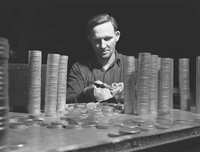 Framed Print : Circular blanks of copper and crass inspected for flaws in metal structure before they become shell casings for the U.S. in World War II Framed Print : Circular blanks of copper and crass inspected for flaws in metal structure before they become shell casings for the U.S. in World War II