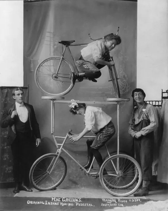 Framed Print : Circus and vaudeville acts, a woman between bars of bicycle on platform over tricycle, caption: Mae Gordon's original insane moving pedestal, circa December 9, 1907 Framed Print : Circus and vaudeville acts, a woman between bars of bicycle on platform over tricycle, caption: Mae Gordon's original insane moving pedestal, circa December 9, 1907
