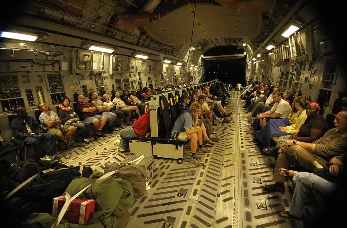 Framed Print : US citizens evacuated from earthquake stricken Haiti in a Air Force C-17 transport. Jan. 15 2010. (BSLOC_2011_12_384)