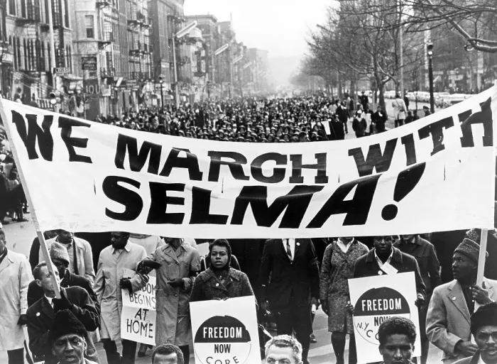 Framed Print : Civil Rights, Marchers carrying banner 'We march with Selma!' on street in Harlem, New York City. Photo by Stanley Wolfson, 1965