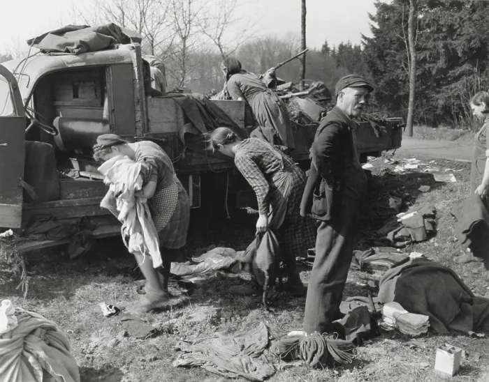 Framed Print : Civilians loot a knocked out German vehicle loaded with clothing and food. March 28, 1945 near Herborn, Germany. World War 2. (BSLOC_2014_8_86) Framed Print : Civilians loot a knocked out German vehicle loaded with clothing and food. March 28, 1945 near Herborn, Germany. World War 2. (BSLOC_2014_8_86)