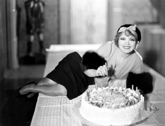 Framed Print : Clara Bow, celebrating her 25th birthday on the set of HER WEDDING NIGHT, July 1930