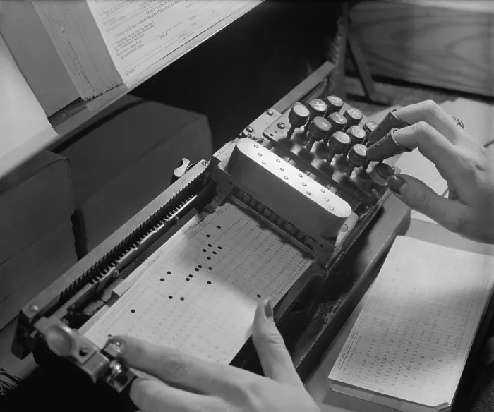 Framed Print : Close up of mechanism used to make precise holes on computer punch cards at U.S. Bureau of the Census, ca. 1940. (BSLOC_2013_8_184)