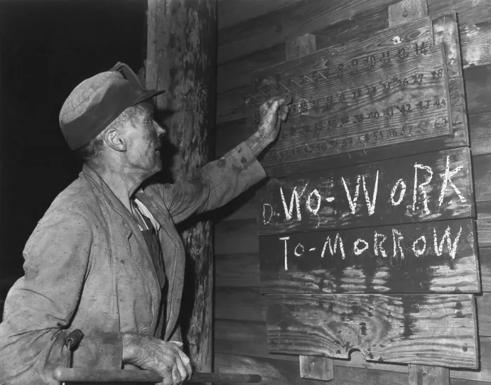 Framed Print : A coal loader putting up his check at the end of day's work on Friday, Sept. 13, 1946
