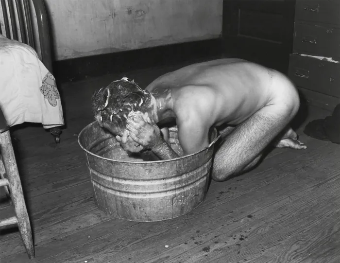 Framed Print : Coal miner Milong Bond taking a bath from a metal wash basin. His home probably lacks an indoor bathroom. Wyoming County, West Virginia. August 23, 1946. By Russell Lee