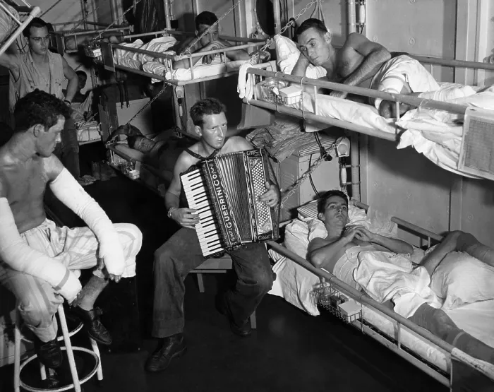 Framed Print : Coast Guard sailors wounded in the Southwest Pacific are entertained by an accordian player, 1945.. Courtesy: CSU Archives  /  Everett Collection
