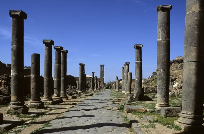 Framed Print : Columned Way, 2nd Century a.C. basalt - Syria, Bosra. Whole view. Overall view of the columned paved Via with capitals and pedestals