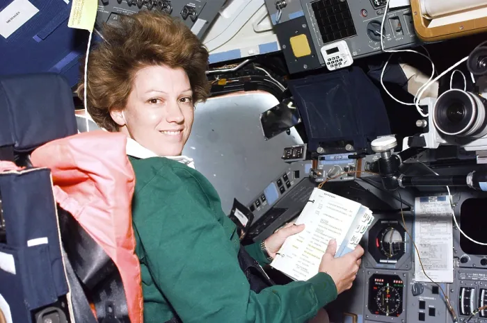 Framed Print : Commander Eileen Collins consults a checklist at the flight deck Commander's station in the Shuttle Columbia. July 24, 1999 Framed Print : Commander Eileen Collins consults a checklist at the flight deck Commander's station in the Shuttle Columbia. July 24, 1999