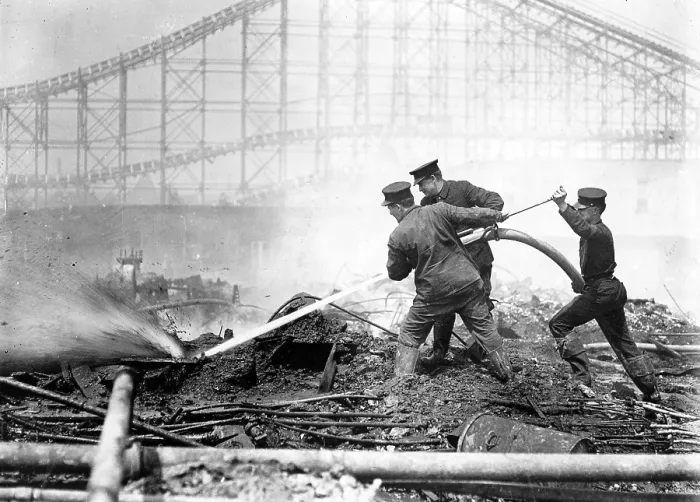 Framed Print : Coney Island, the Dreamland fire, men extinguishing the fire at Dreamland, roller coaster in background, Coney Island, New York, photograph, 1911