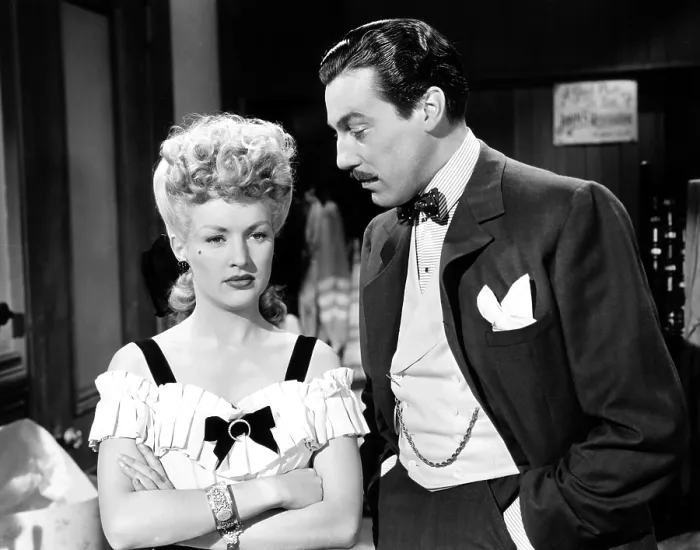 Framed Print : CONEY ISLAND, from left, Betty Grable, Cesar Romero, 1943, TM & copyright 20th Century Fox Film Corp. All rights reserved / courtesy Everett Collection