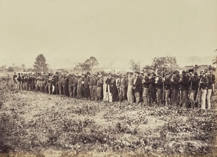 Framed Print : Confederate Prisoners, captured at the Battle of Fairfax Court-House, June 27, 1863. There are uniformed Union guards on both sides of the formation