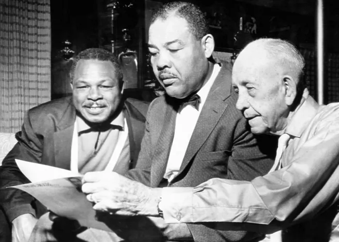 Framed Print : Conferring on the possibility of an Archie Moore vs. Gene Fuller. L-R: Moore, matchmaker Joe Lewis, and Moore's manager Jack Doc Kearns. (CSU_2015_11_1527)