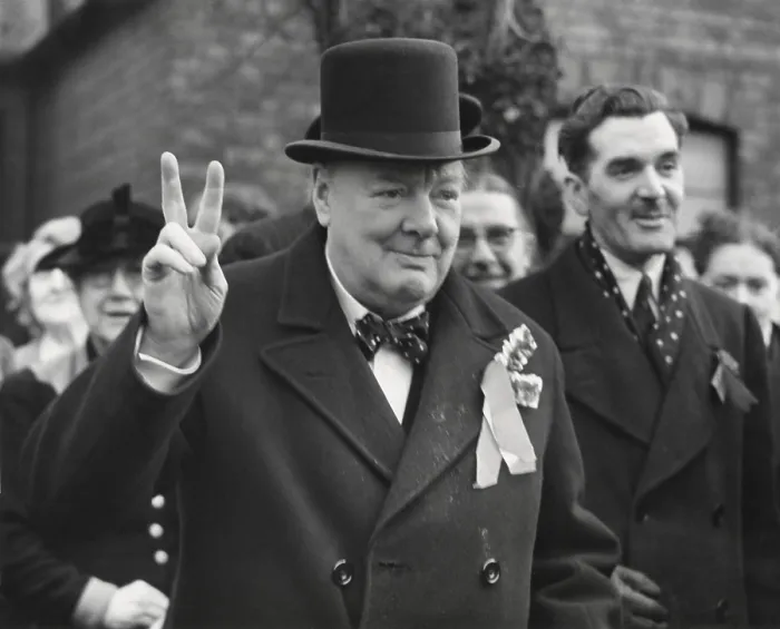 Framed Print : Conservative Party Leader Winston Churchill gives his familiar victory sign. He was making a last-minute campaign tour before the General Election. Woodford, Essex. Feb. 23, 1950