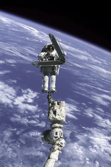 Framed Print : Construction work on International Space Station. Astronaut Lee Morin totes a large, but weightless, metal piece just removed from the space station exterior Framed Print : Construction work on International Space Station. Astronaut Lee Morin totes a large, but weightless, metal piece just removed from the space station exterior