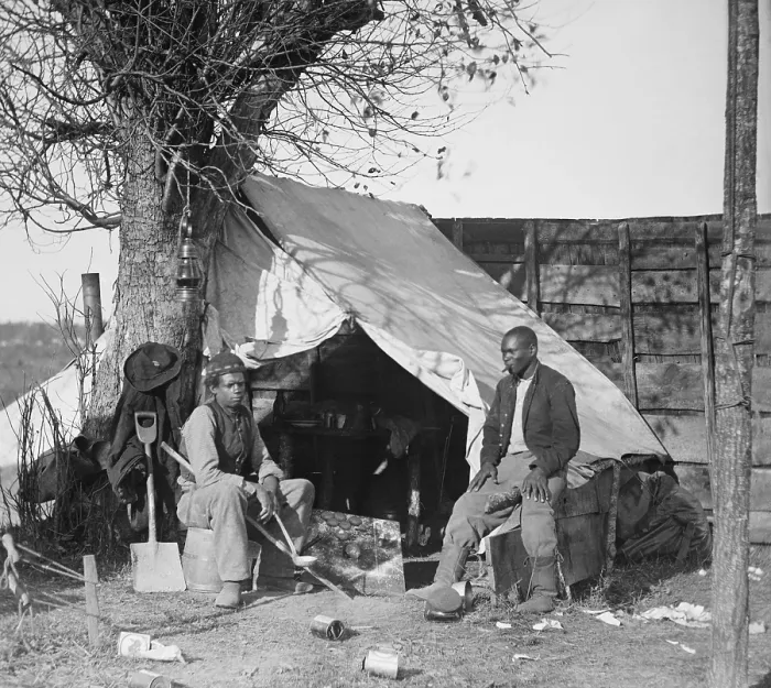 Framed Print : Contrabands of the Union Army during the Civil War sitting in front of a tent, one with cigar and the other with a soup ladle Framed Print : Contrabands of the Union Army during the Civil War sitting in front of a tent, one with cigar and the other with a soup ladle
