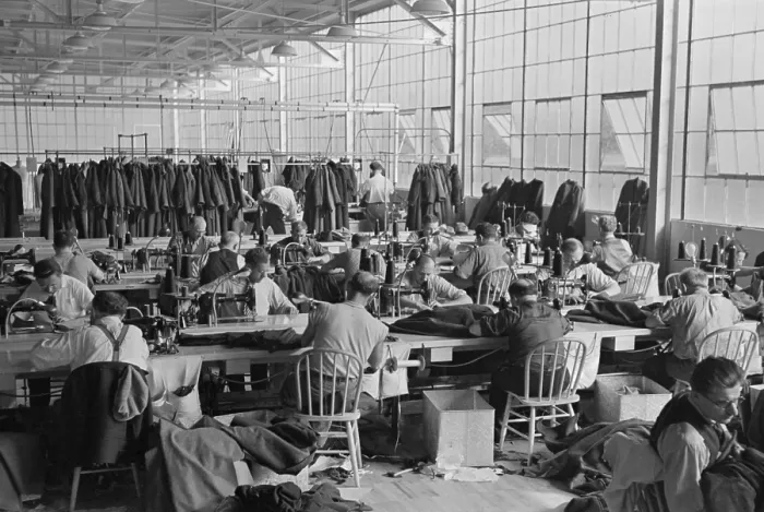 Framed Print : Cooperative garment factory at Jersey Homesteads, showing homesteaders at their work and some of the ladies coats made by them. Nov. 1936
