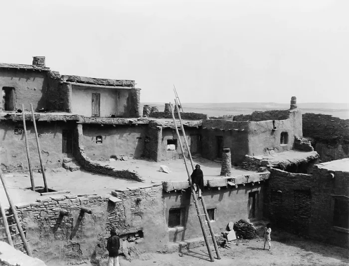 Framed Print : A CORNER OF ZUNI, by Edward S. Curtis, 1903. The photo shows three Zuni Indians in the multistoried, terraced, adobe building attached homes