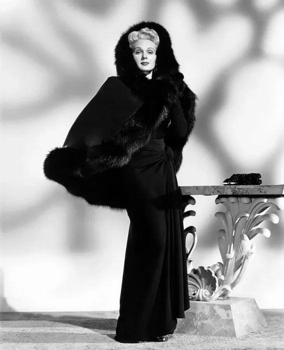 Framed Print : THE CORPSE CAME C.O.D. Adele Jergens, in a dress and cape by Jean Louis, 1947