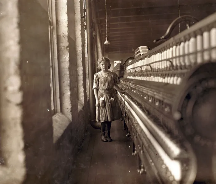 Framed Print : Cotton Mill. An underage girl tends a cotton spinner. Daniel Mfg. Co. Lincolnton, North Carolina. Photo by Lewis Hine Wickes, Nov 1908 Framed Print : Cotton Mill. An underage girl tends a cotton spinner. Daniel Mfg. Co. Lincolnton, North Carolina. Photo by Lewis Hine Wickes, Nov 1908