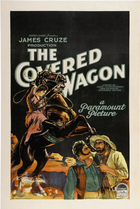 Framed Print : THE COVERED WAGON, background, left: Lois Wilson on horse; foreground bottom, left to right: Alan Hale Sr. Ernest Torrence, 1923 Framed Print : THE COVERED WAGON, background, left: Lois Wilson on horse; foreground bottom, left to right: Alan Hale Sr. Ernest Torrence, 1923