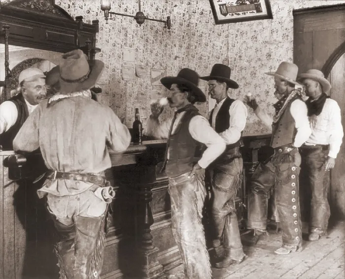 Framed Print : Cowhands line up at the Equity Bar in old Tascosa, Texas, 1908