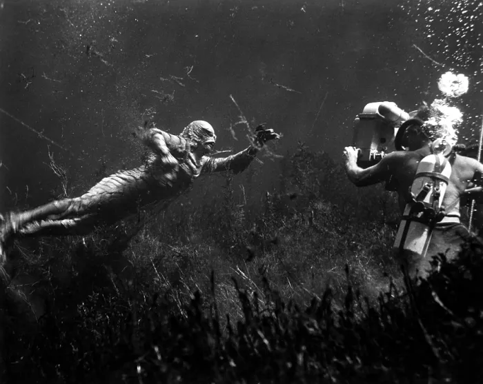 Framed Print : CREATURE FROM THE BLACK LAGOON, shooting underwater scene: Ricou Browning (on left, as The Creature'), cameraman Scotty Welbourne (on right, credited as Charles S)