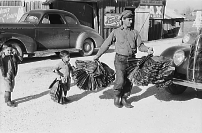 Framed Print : Creole trapper and his childen taking muskrat pelts into the FSA (Farm Security Administration) auction sale which is held in a dancehall on Delacroix Island, Louisiana