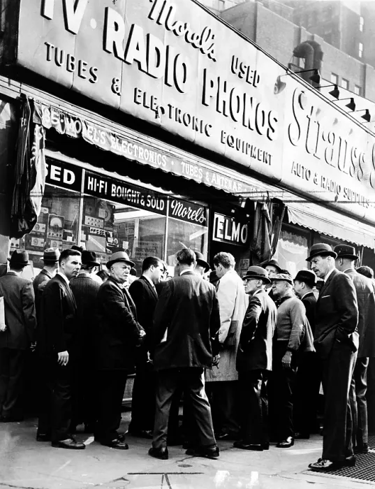 Framed Print : Crowd listens outside radio shop at Greenwich and Dey Sts. for news on President Kennedy. Photo by Orlando Fernandez, November 22, 1963