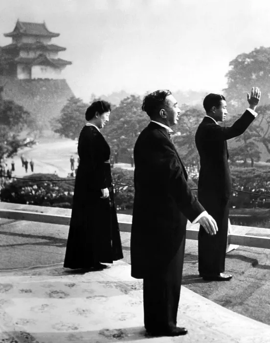 Framed Print : Crown Prince Akihito waves to cheering well wishers after he was proclaimed heir apparent to the throne. Behind him are his parents, Emperor Hirohito and Empress Nagako. ca. 1952