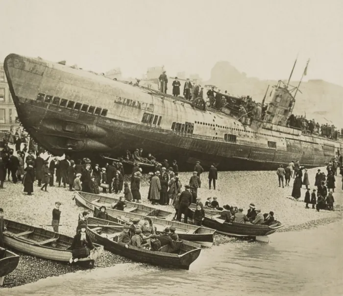 Framed Print : Curious civilians swarm over a stranded German U-boat on Englands south coast, 1918. In front of the conning tower is a cannon, which was lowered into the hull when submerged