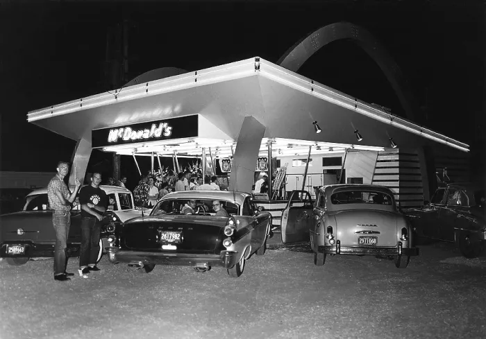 Framed Print : Customers at a the first McDonald's restaurant opened by Ray Kroc in Des Plaines Illinois near Chicago on April 15 1955 the same day that Kroc incorporated his company as Framed Print : Customers at a the first McDonald's restaurant opened by Ray Kroc in Des Plaines Illinois near Chicago on April 15 1955 the same day that Kroc incorporated his company as