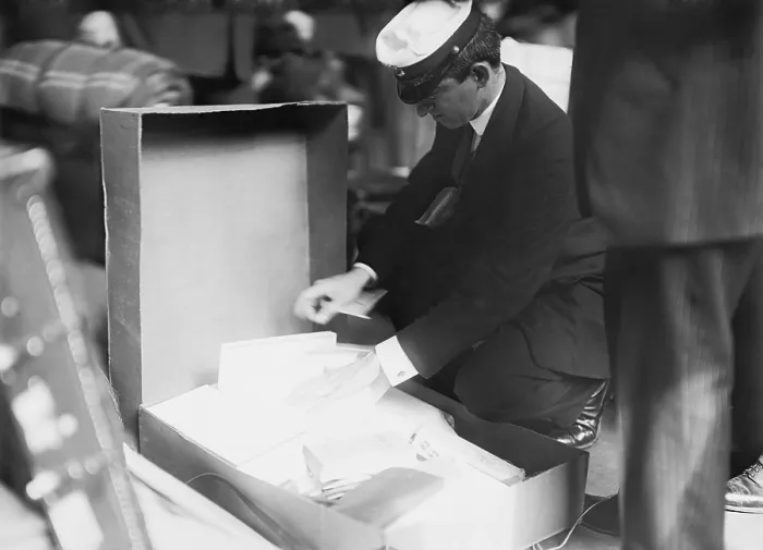 Framed Print : Customs officer inspecting luggage of a passenger at the Norddeutscher Lloyd pier in New York City. Ca. 1909 LC-DIG-ggbain-04210