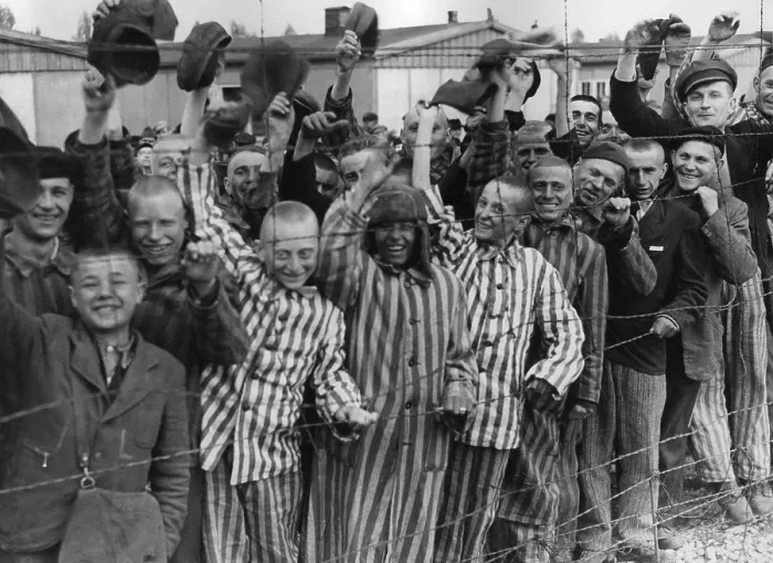 Framed Print : Dachau Prisoners wave and cheer the Seventh US Army liberators from behind a barbed wire fence. April 29, 1945, World War 2 (BSLOC_2015_13_19) Framed Print : Dachau Prisoners wave and cheer the Seventh US Army liberators from behind a barbed wire fence. April 29, 1945, World War 2 (BSLOC_2015_13_19)
