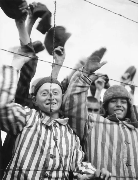 Framed Print : Dachau Prisoners wave and cheer the Seventh US Army liberators from behind a barbed wire fence. April 29, 1945, World War 2 (BSLOC_2015_13_20)