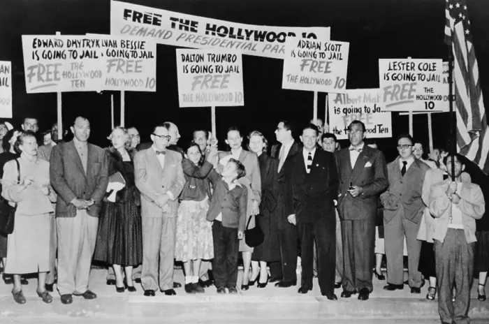 Framed Print : Dalton Trumbo (1905-1976) surrounded by supporters with signs