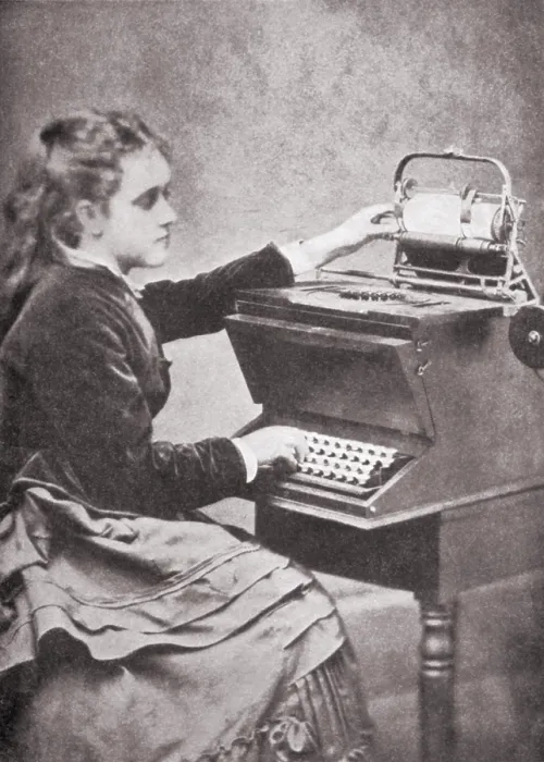 Framed Print : The daughter of inventor Christopher Sholes writing on one of his experimental typewriters in 1872