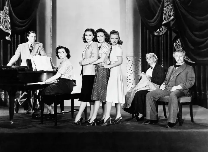 Framed Print : FOUR DAUGHTERS, Jeffrey Lynn (standing left), Gale Page (at piano), standing center from left: Lola Lane, Rosemary Lane, Priscilla Lane, seated right from left: May Robson