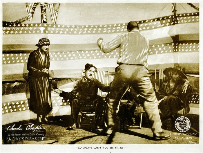 Framed Print : A DAY'S PLEASURE, from left: Edna Purviance, Charlie Chaplin, Tom Wilson on lobbycard, 1919