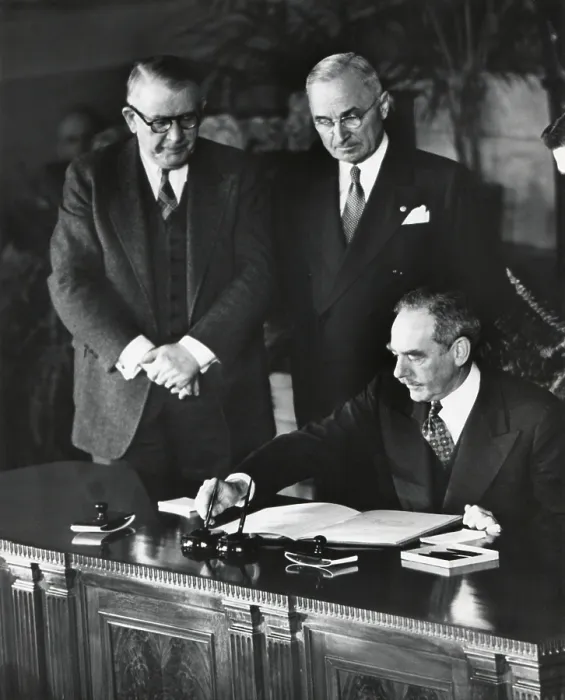 Framed Print : Dean Acheson, Sec. of State, signs the North Atlantic Treaty establishing the NATO alliance. President Harry Truman and Vice President Alben Barkley witness. April 4, 1949 Framed Print : Dean Acheson, Sec. of State, signs the North Atlantic Treaty establishing the NATO alliance. President Harry Truman and Vice President Alben Barkley witness. April 4, 1949