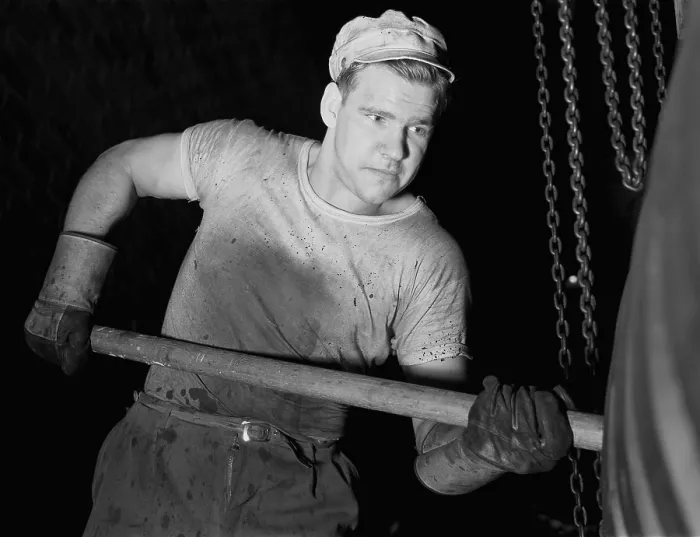 Framed Print : Defense worker at the Goodrich rubber plant molding rubber with a wooden paddle. December 1941 Framed Print : Defense worker at the Goodrich rubber plant molding rubber with a wooden paddle. December 1941