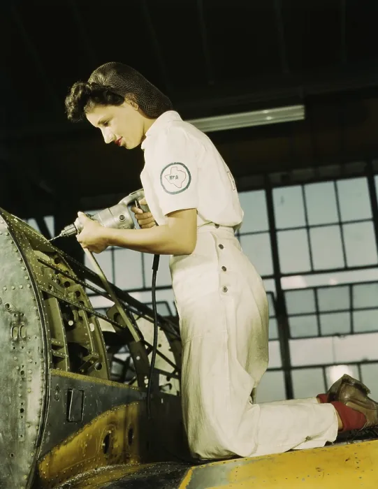 Framed Print : Defense worker riveting as part of her training to become a mechanic at the Naval Air Base, in Corpus Christi, Texas. August 1942