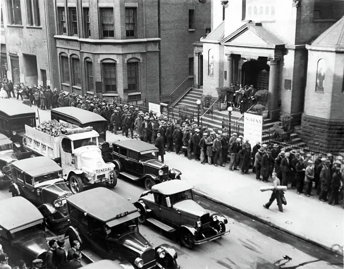 Framed Print : DEPRESSION- Jobless men lined up in front of St. Francis of Assisi Church waiting to receive a nickel each from Father Gabriel. New York, 1930s